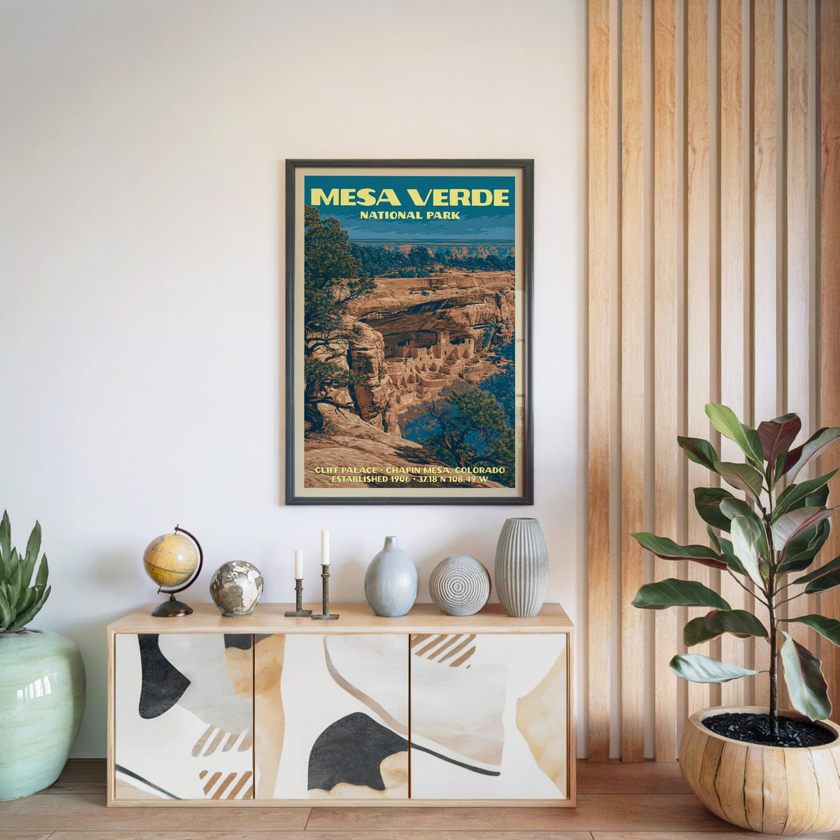Mesa Verde National Park poster in a black frame above a light wood sideboard by a slatted wall panel