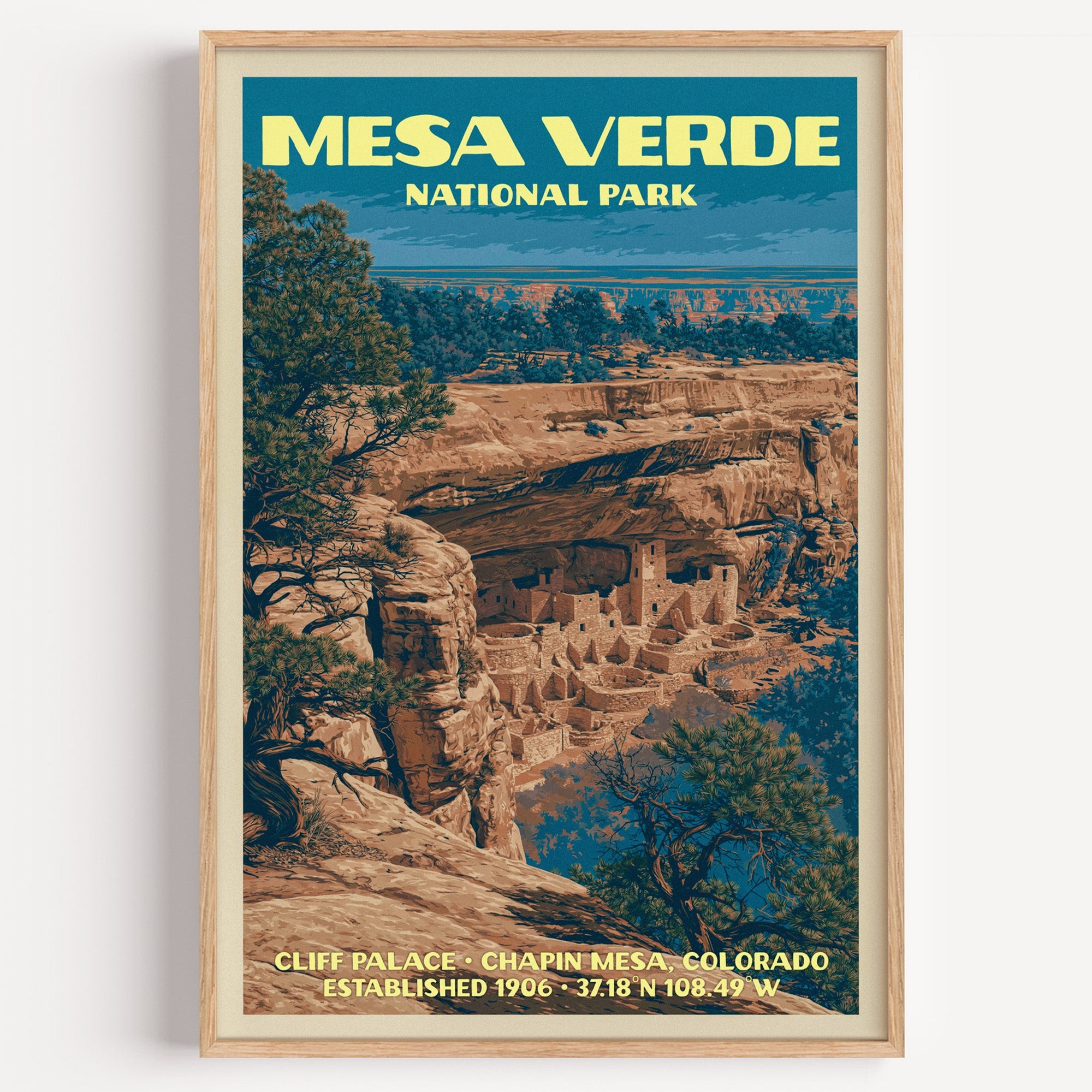 Cliff Palace Mesa Verde vintage poster in a light oak frame on a plain white wall