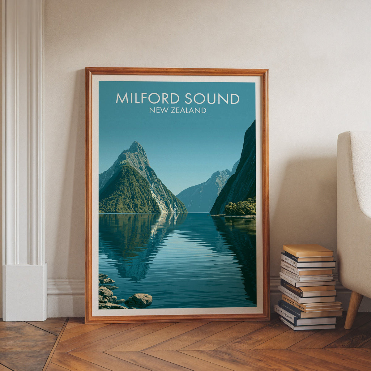 Mitre Peak artwork in a walnut frame on herringbone floor beside stacked books and an armchair