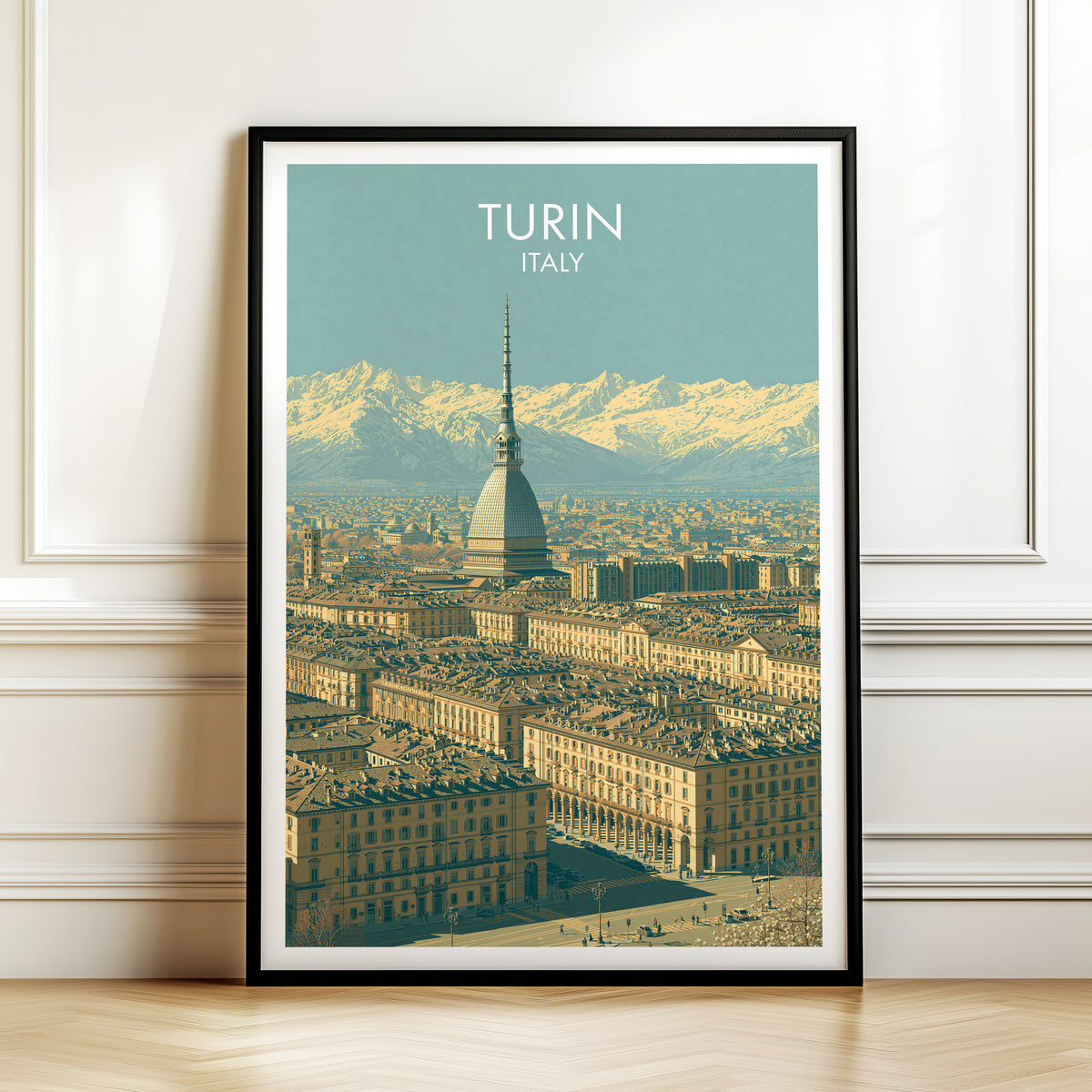 Mole Antonelliana spire print, black frame leaning on a white panelled wall above a herringbone floor
