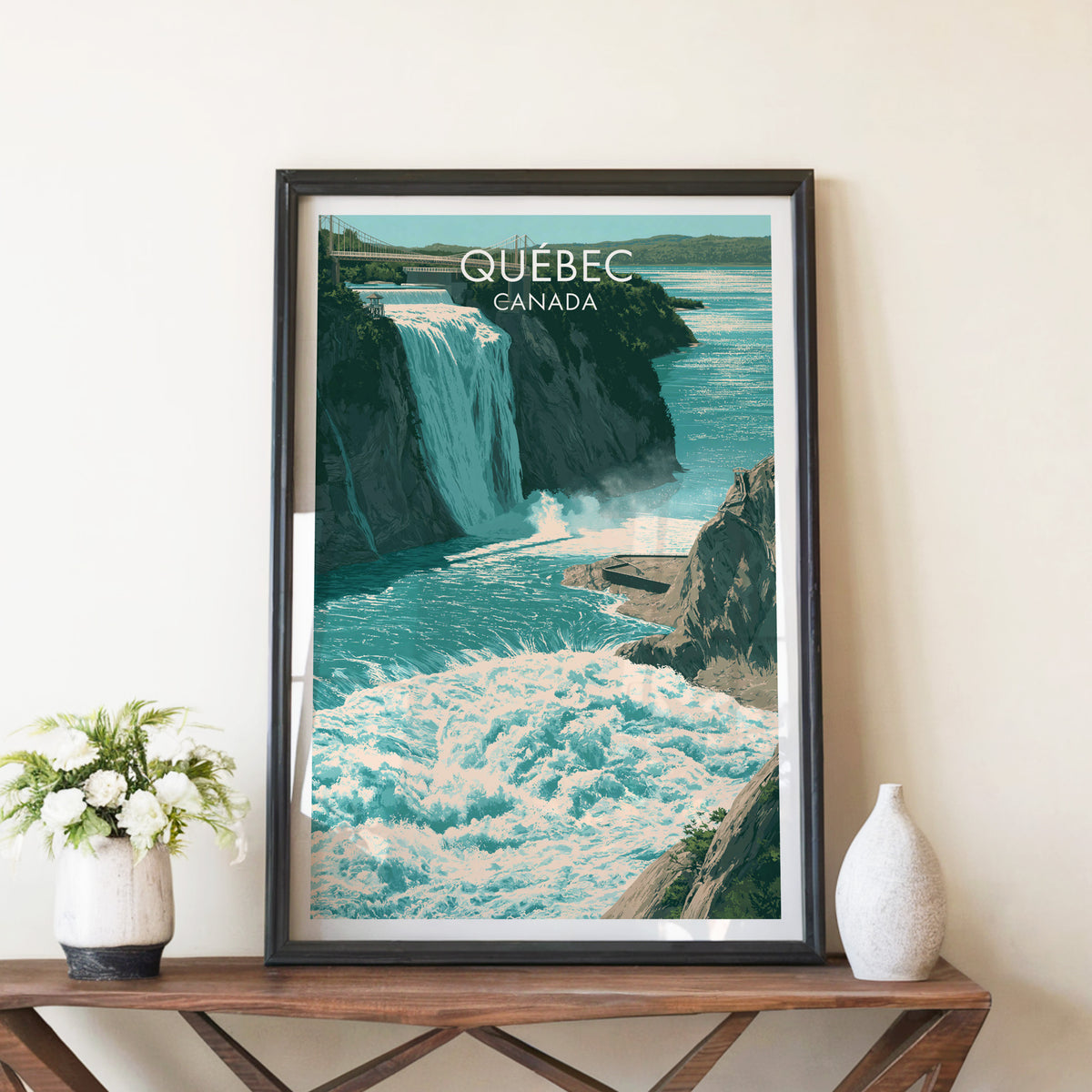 Montmorency waterfall print in a black frame on a walnut console beside white peonies