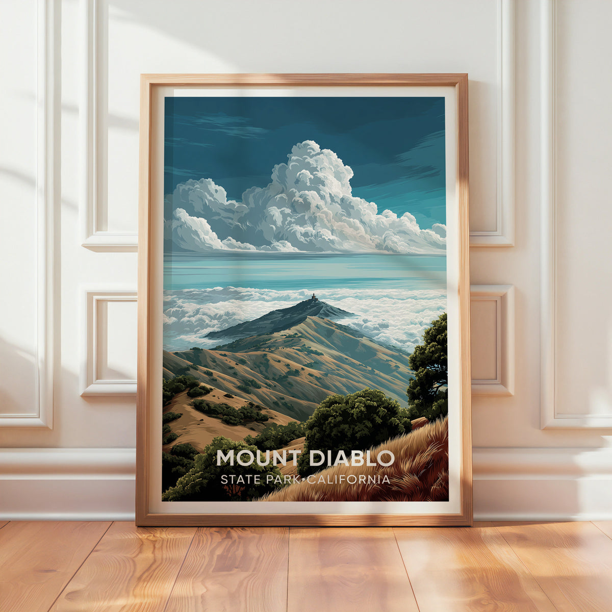 Mount Diablo print in oak leaning on a panelled white wall with light across the wooden floor