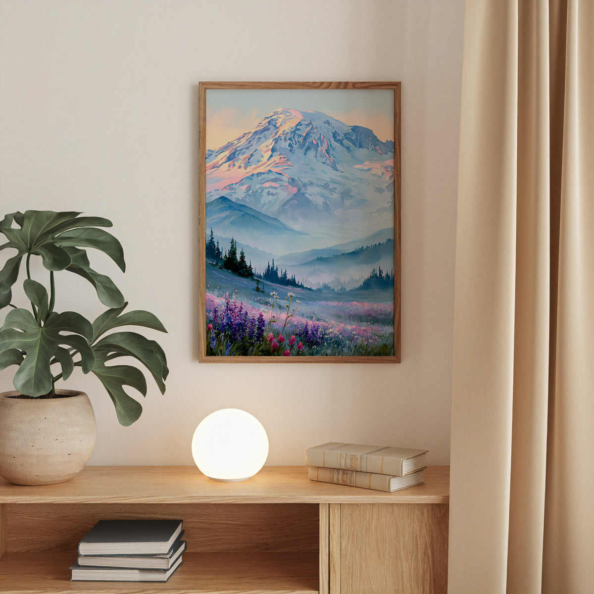 Mount Rainier National Park watercolor print in an oak frame above a console table with a globe lamp and monstera