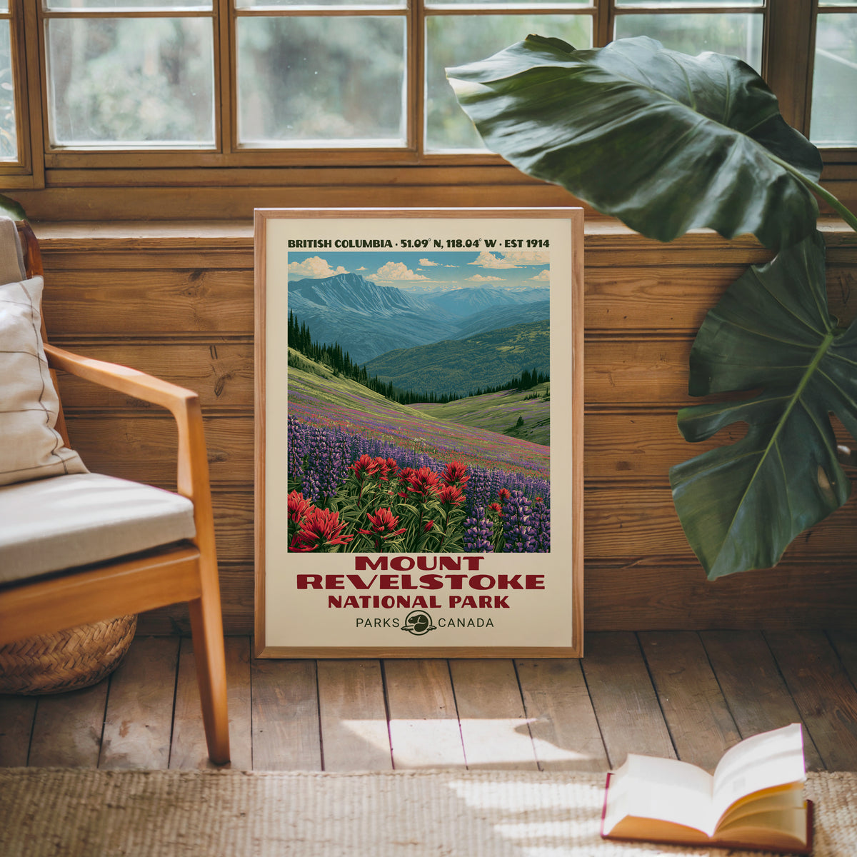 Mount Revelstoke Canada poster in an oak frame against a pine cabin wall beside a monstera
