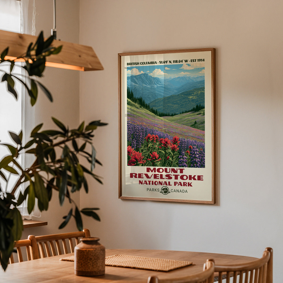 Mount Revelstoke wildflower meadow poster in an oak frame in a dining corner above an oak table