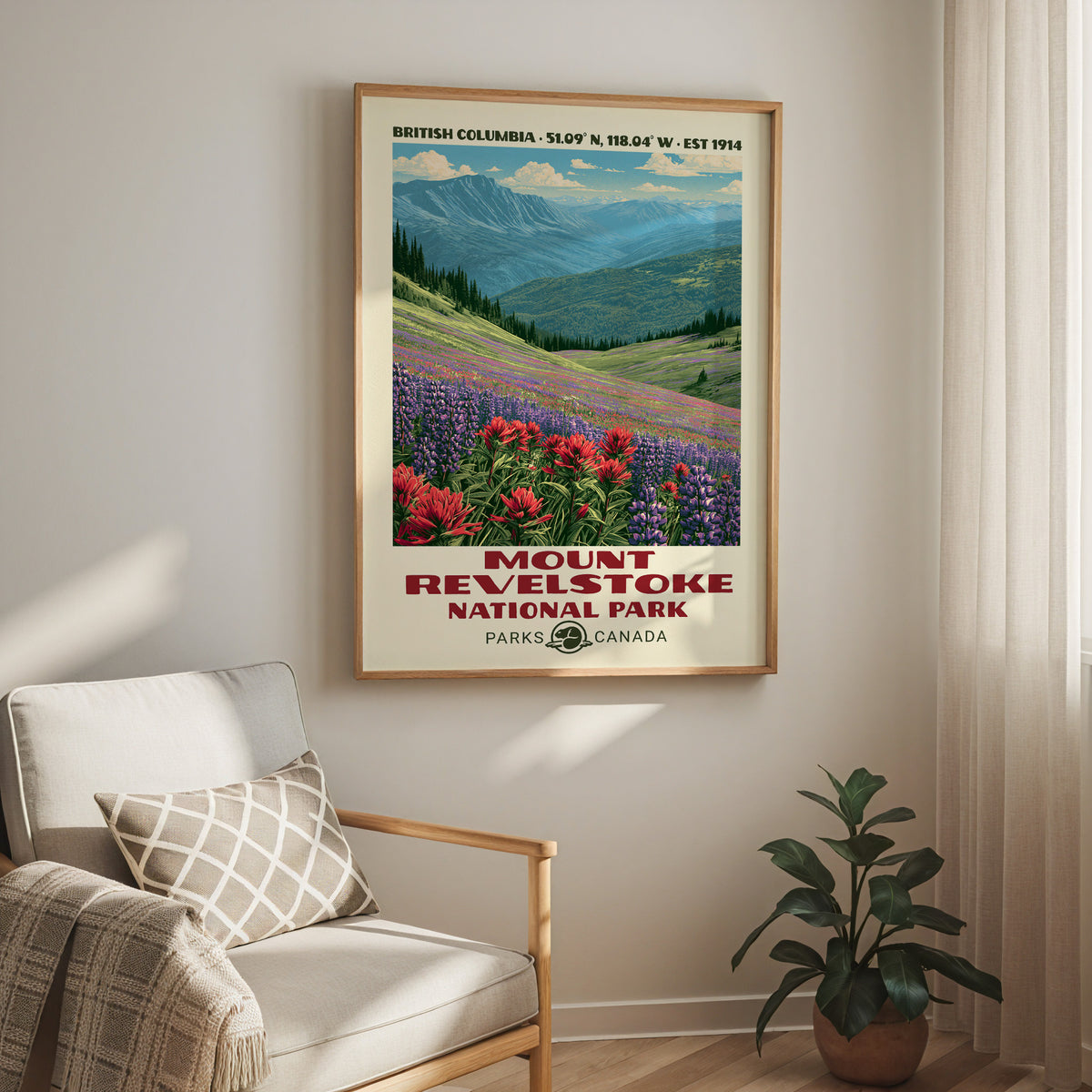 Mount Revelstoke National Park print in an oak frame above a cream armchair and a rubber plant