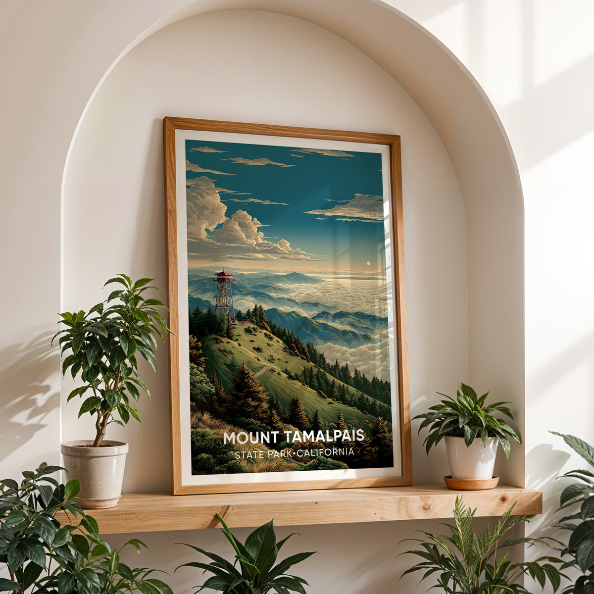 Mount Tamalpais canvas print in oak on a shelf in a white arched niche with plants either side