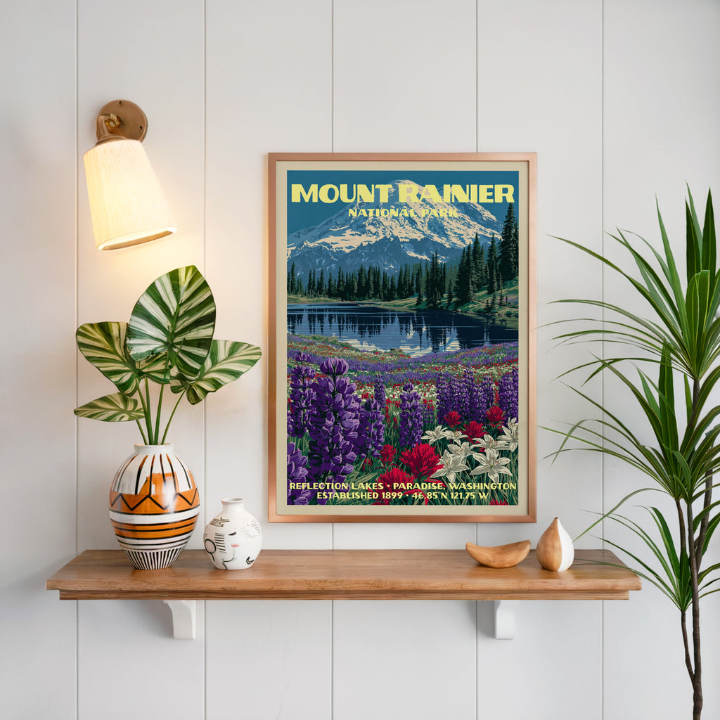 Reflection Lakes Mount Rainier print framed on white panelling above an oak shelf with a patterned vase and sconce