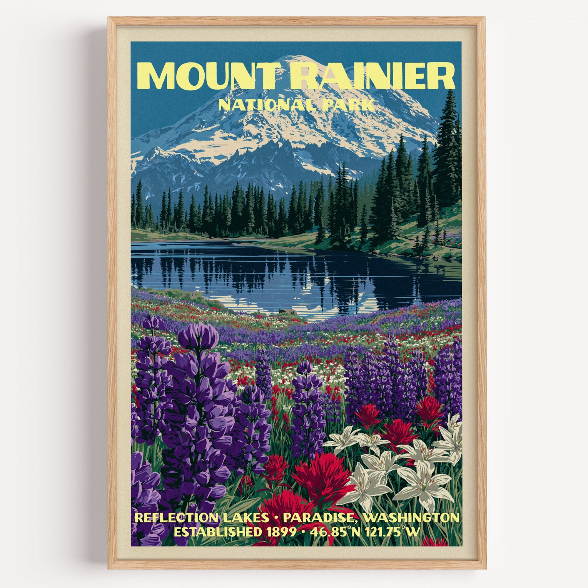Reflection Lakes Mount Rainier vintage poster in a light oak frame on a plain white wall