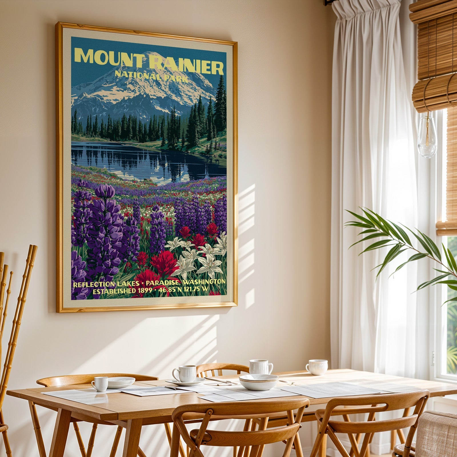 Mount Rainier National Park print in gold above a light oak dining table by a curtained window