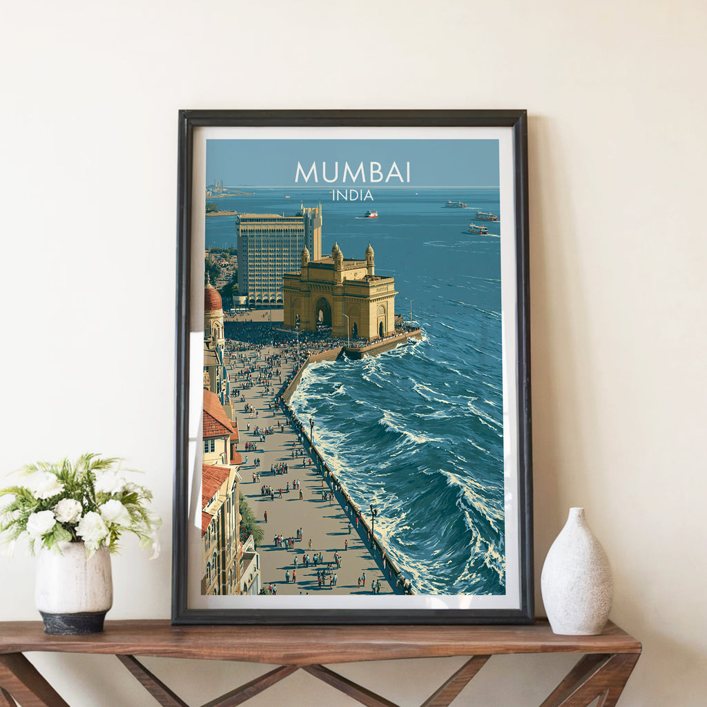 Mumbai India travel poster in a black frame on a wooden console table with white flowers