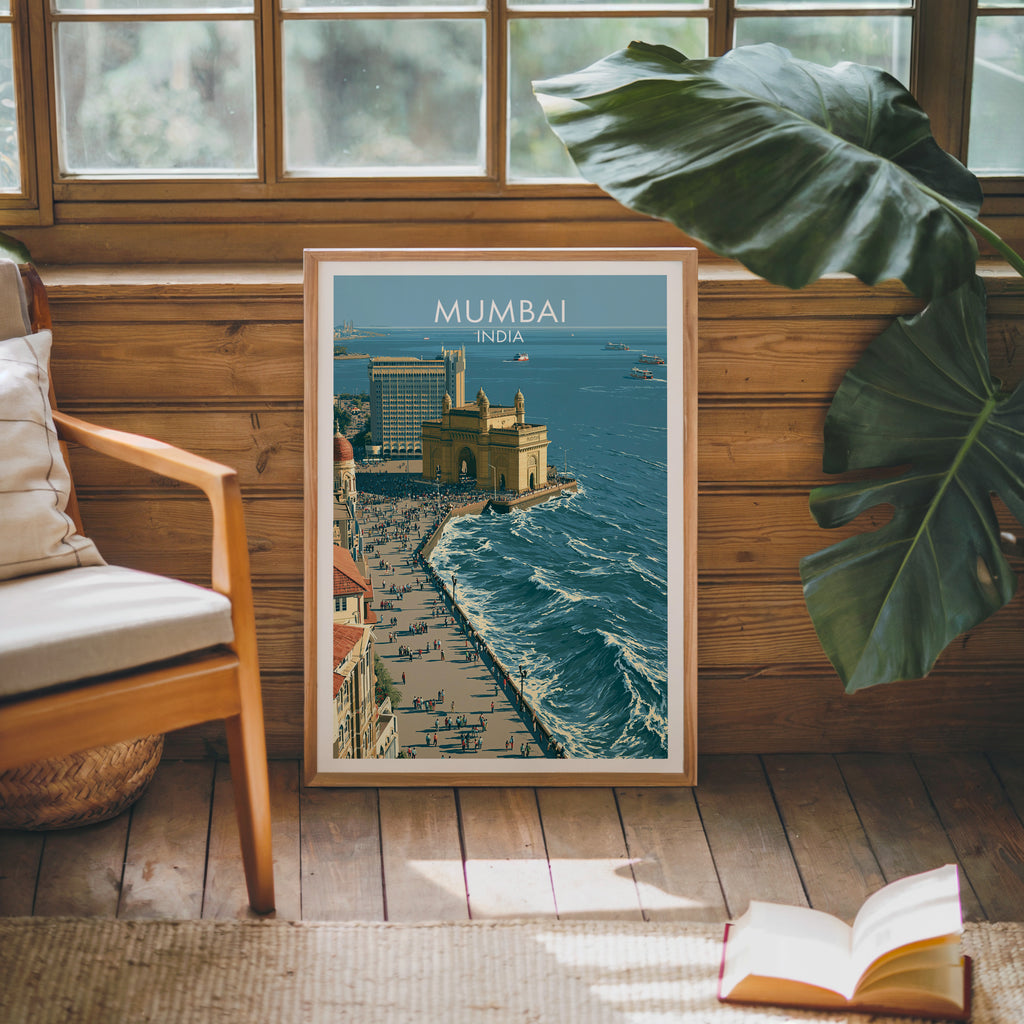 Framed Mumbai India poster leaning against a timber cabin wall with monstera leaves and an open book