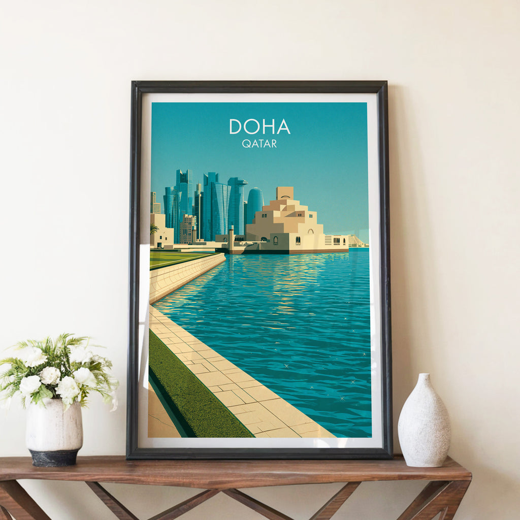 Doha Qatar travel poster in a black frame on a wooden console table with white flowers
