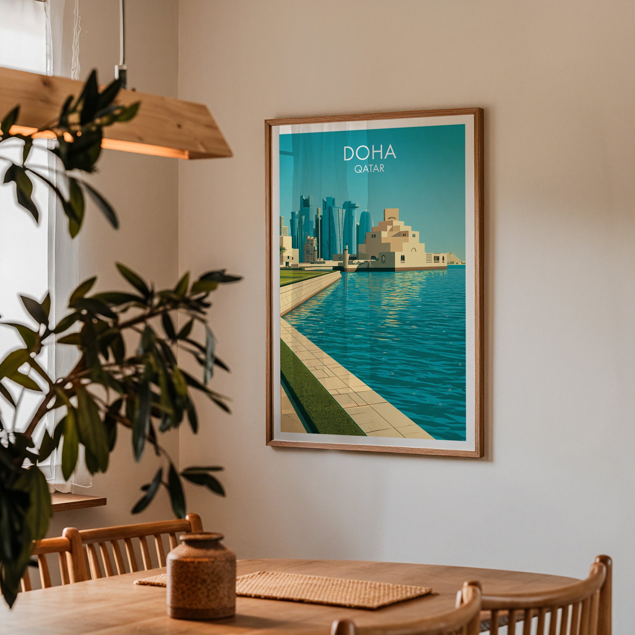 Framed Doha Qatar print on a dining room wall above an oak table in warm afternoon light