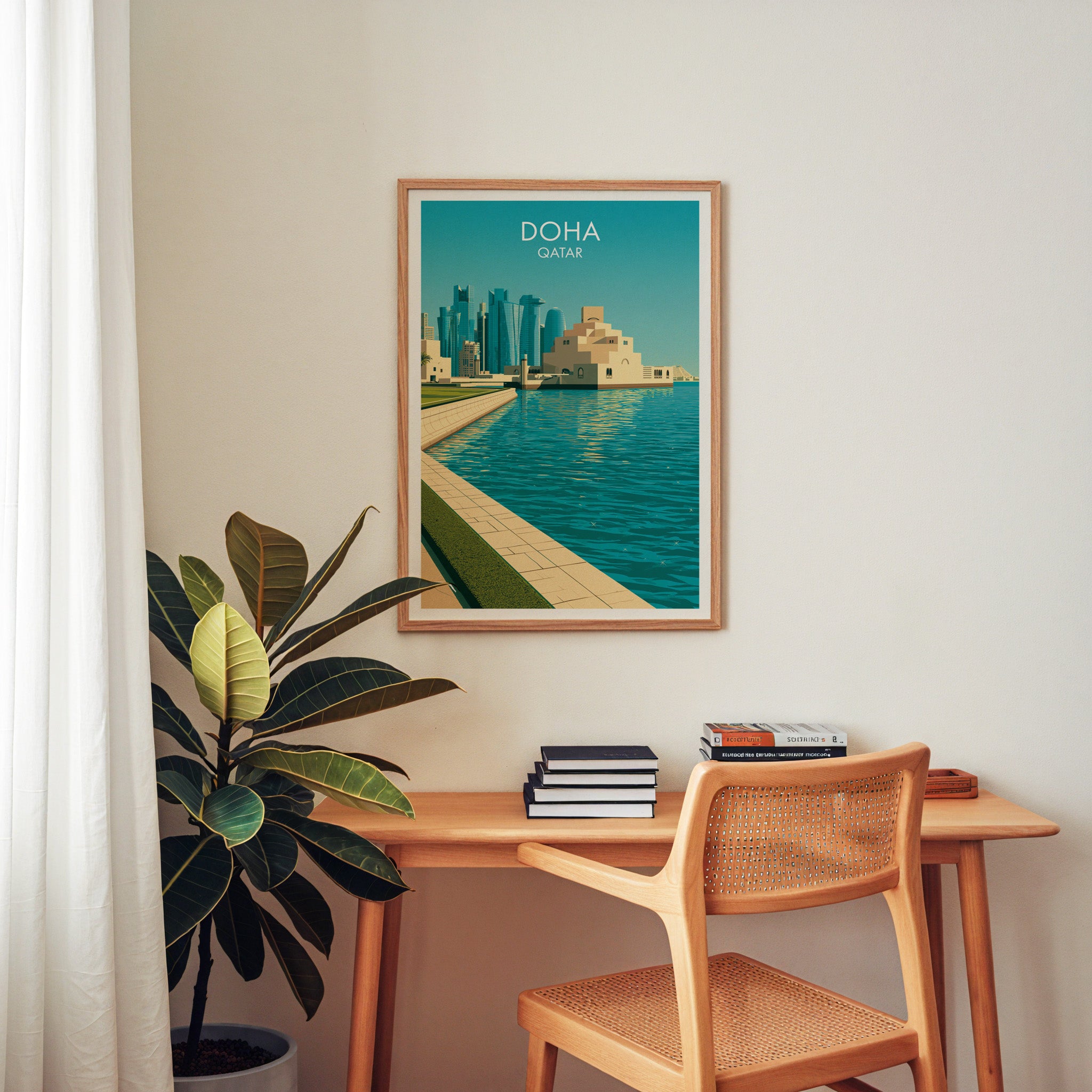 Doha Qatar wall art above a wooden home office desk with a rattan chair and books