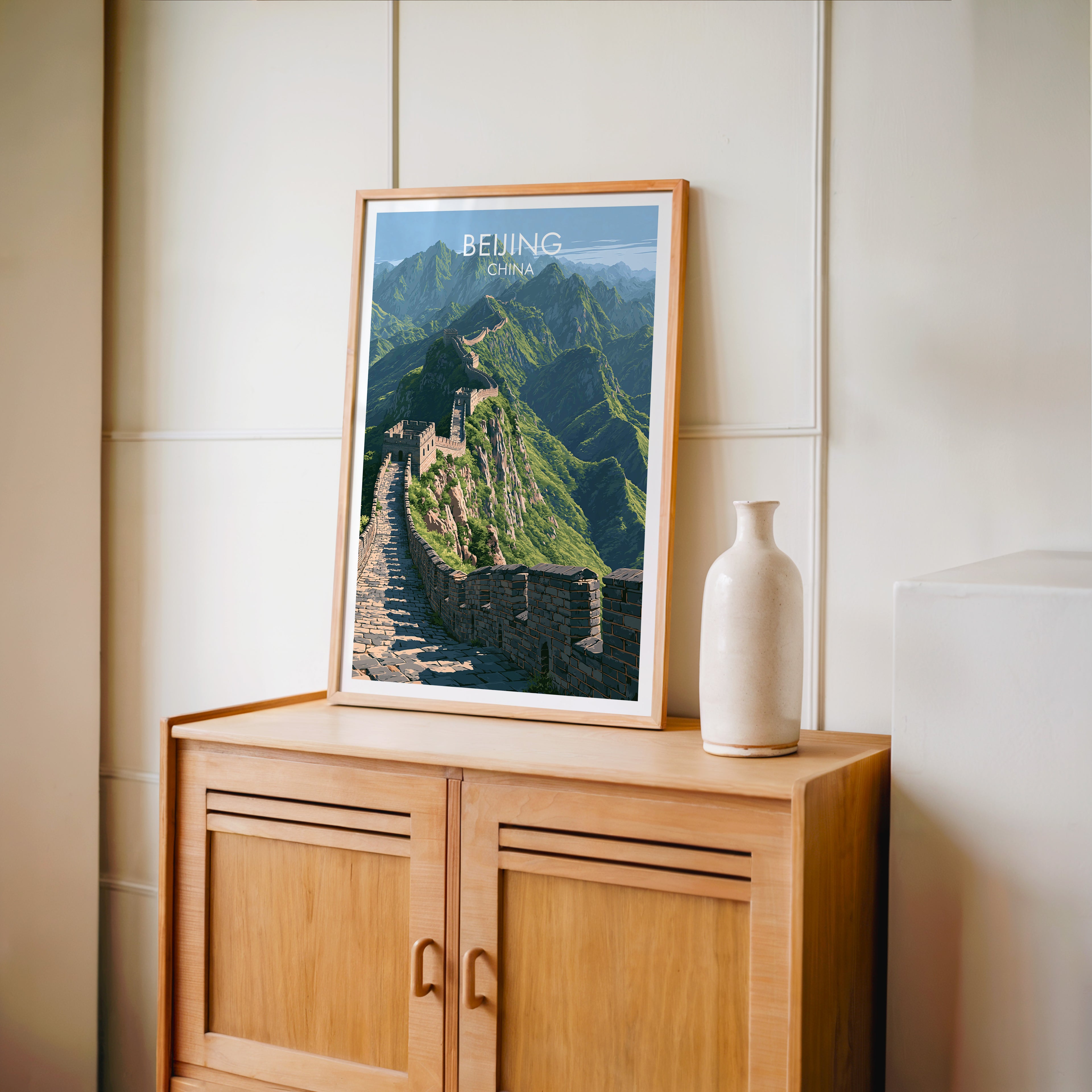 Small Great Wall of China Beijing travel poster in an oak frame on a mid-century sideboard with a ceramic vase