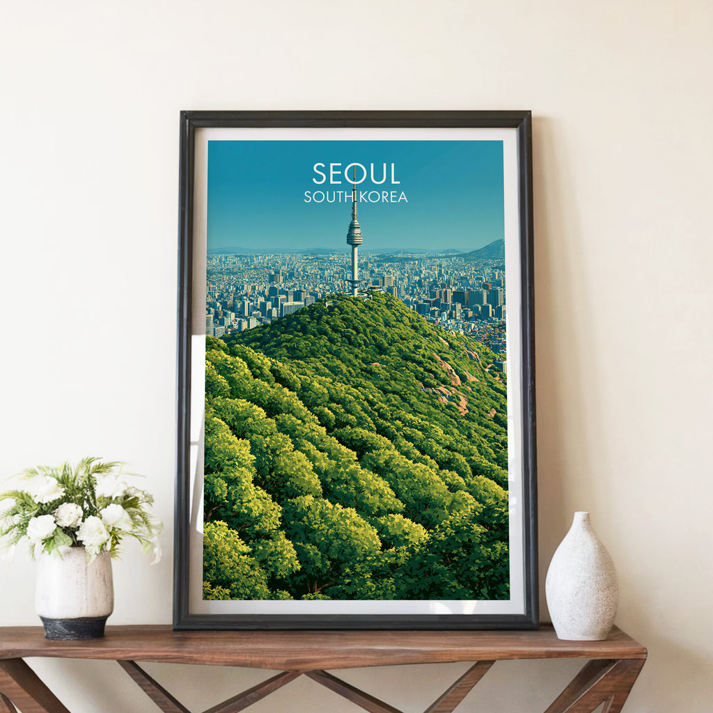 N Seoul Tower Seoul Korea travel poster in a black frame on a wooden console table with white flowers