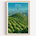 N Seoul Tower Seoul Korea travel poster in a natural wood frame, shown against a clean white wall