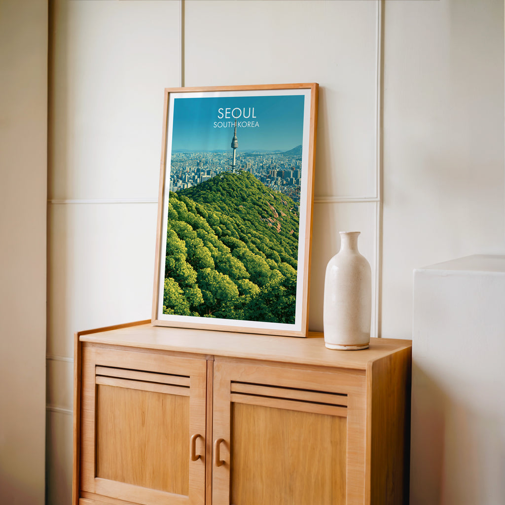 Small N Seoul Tower Seoul Korea travel poster in an oak frame on a mid-century sideboard with a ceramic vase