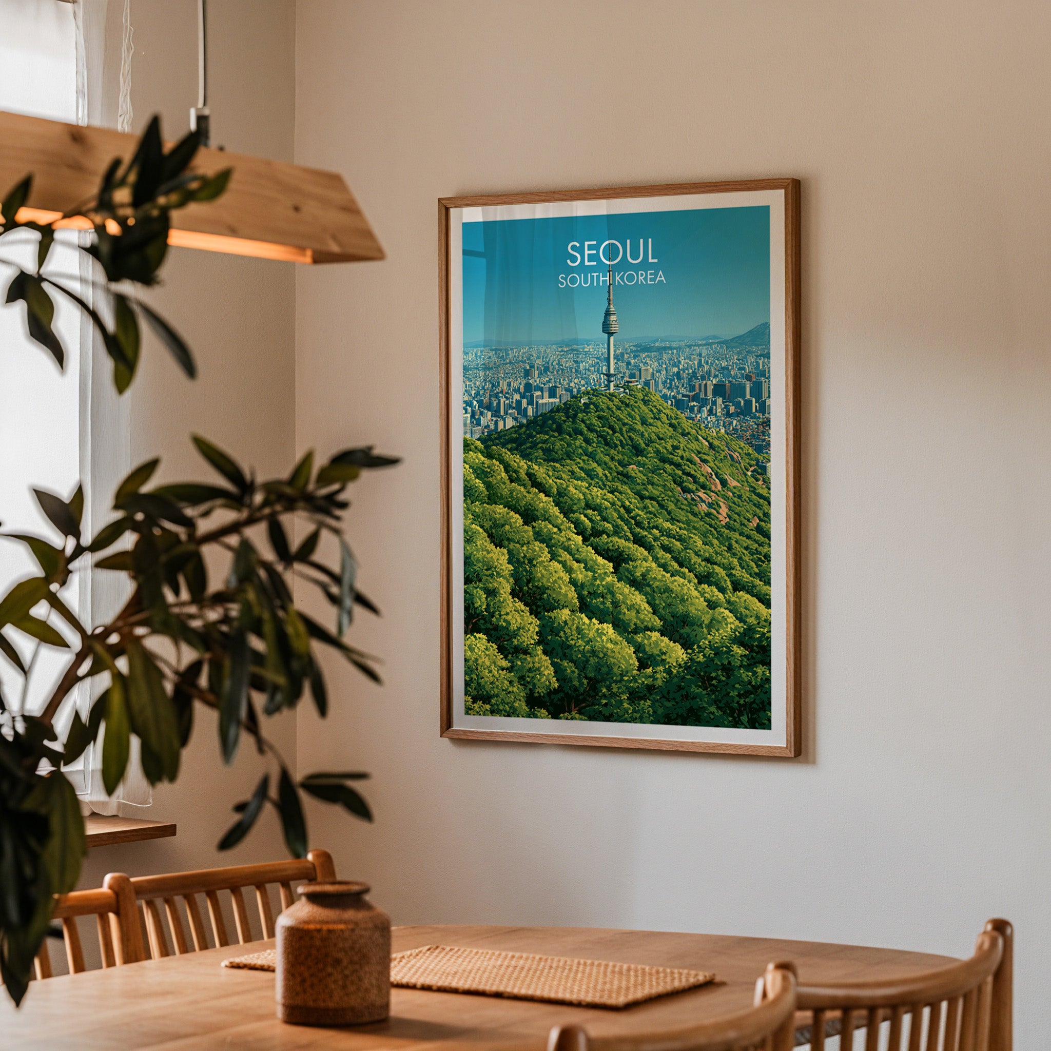 Framed N Seoul Tower Seoul Korea print on a dining room wall above an oak table in warm afternoon light