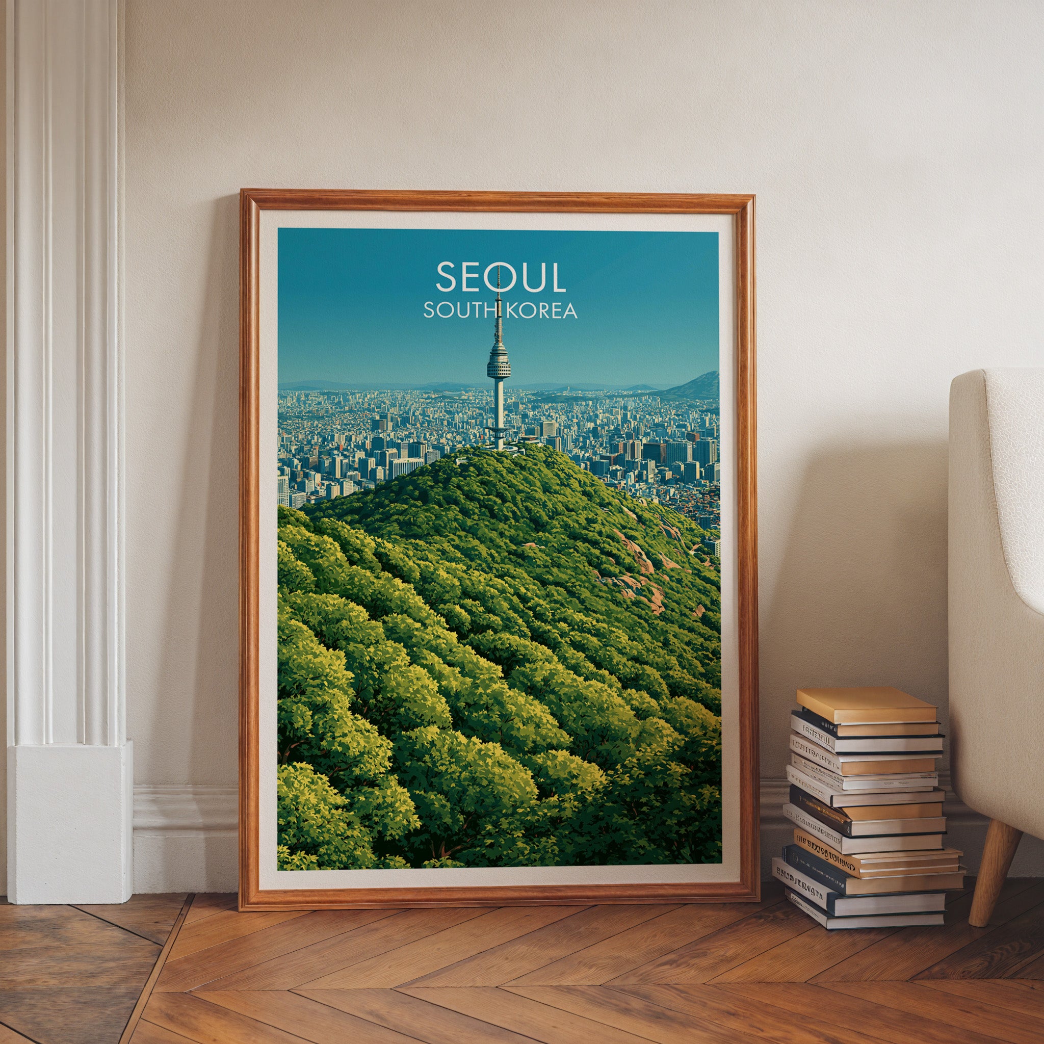 N Seoul Tower Seoul Korea art print in a walnut frame leaning in a hallway beside stacked books