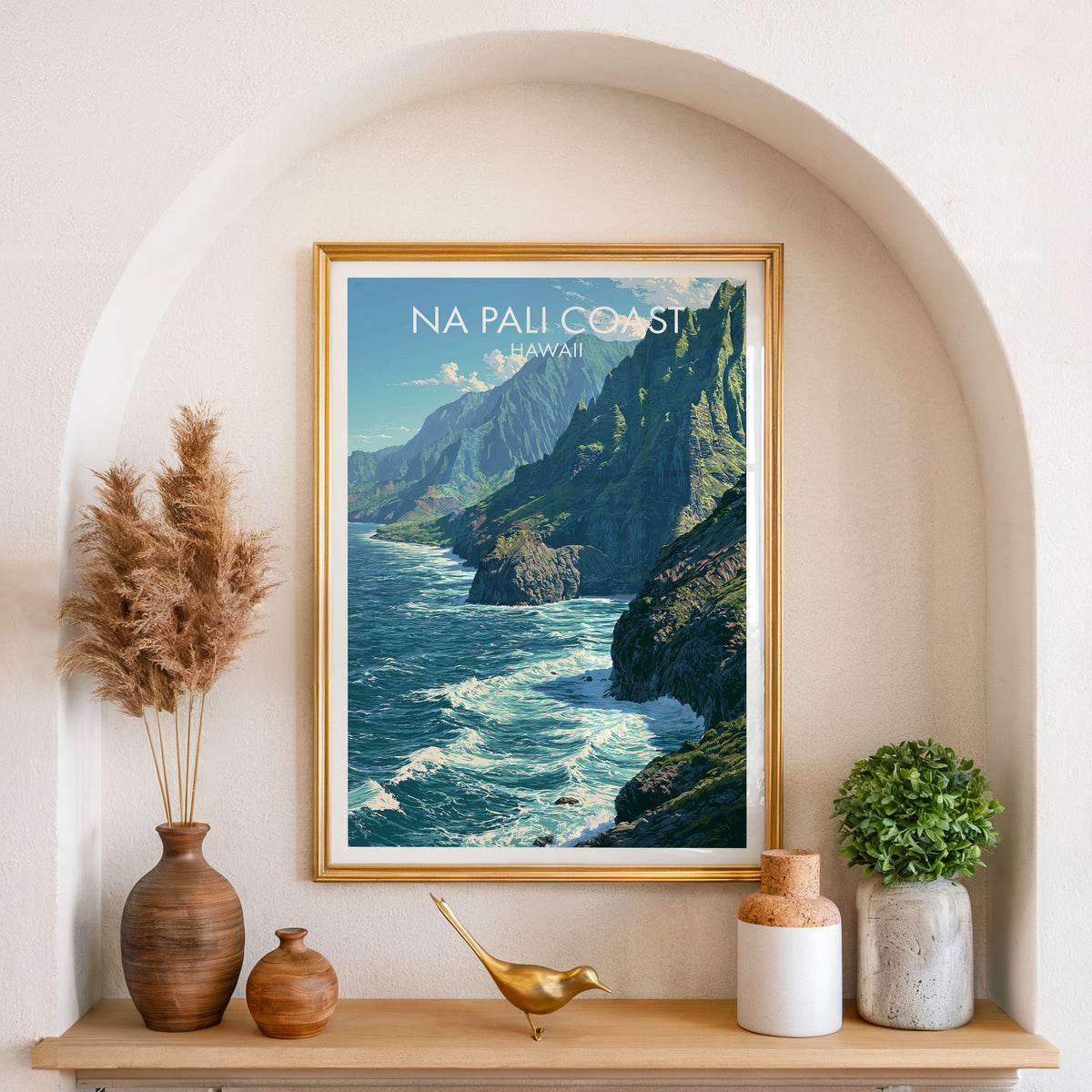 Na Pali Coast Kauai art in a gold frame set in an arched wall niche with pampas grass and a brass bird