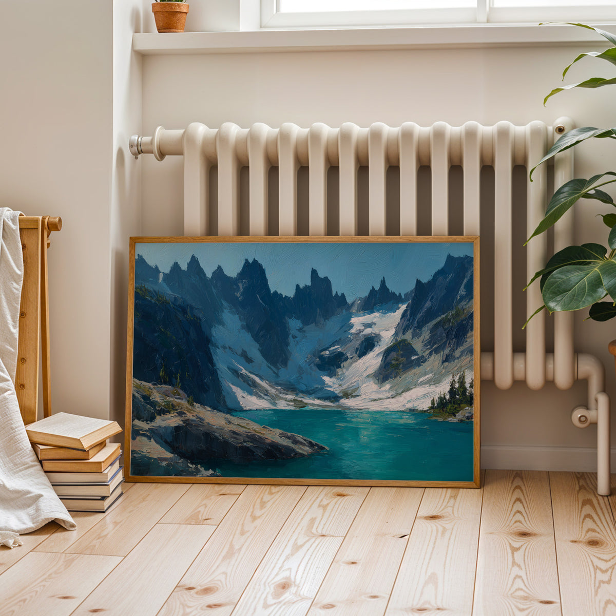 North Cascades oil painting canvas in a walnut frame above a cognac leather sofa