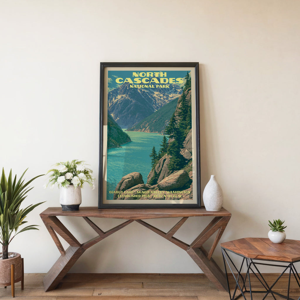 North Cascades Diablo Lake wall art in black, leaning on a walnut console with white anemones and a vase