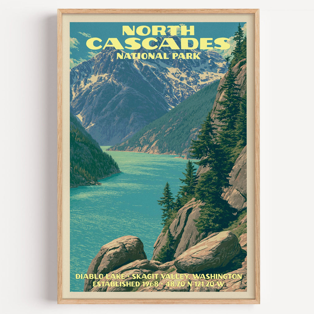 Diablo Lake North Cascades vintage poster in a light oak frame on a plain white wall