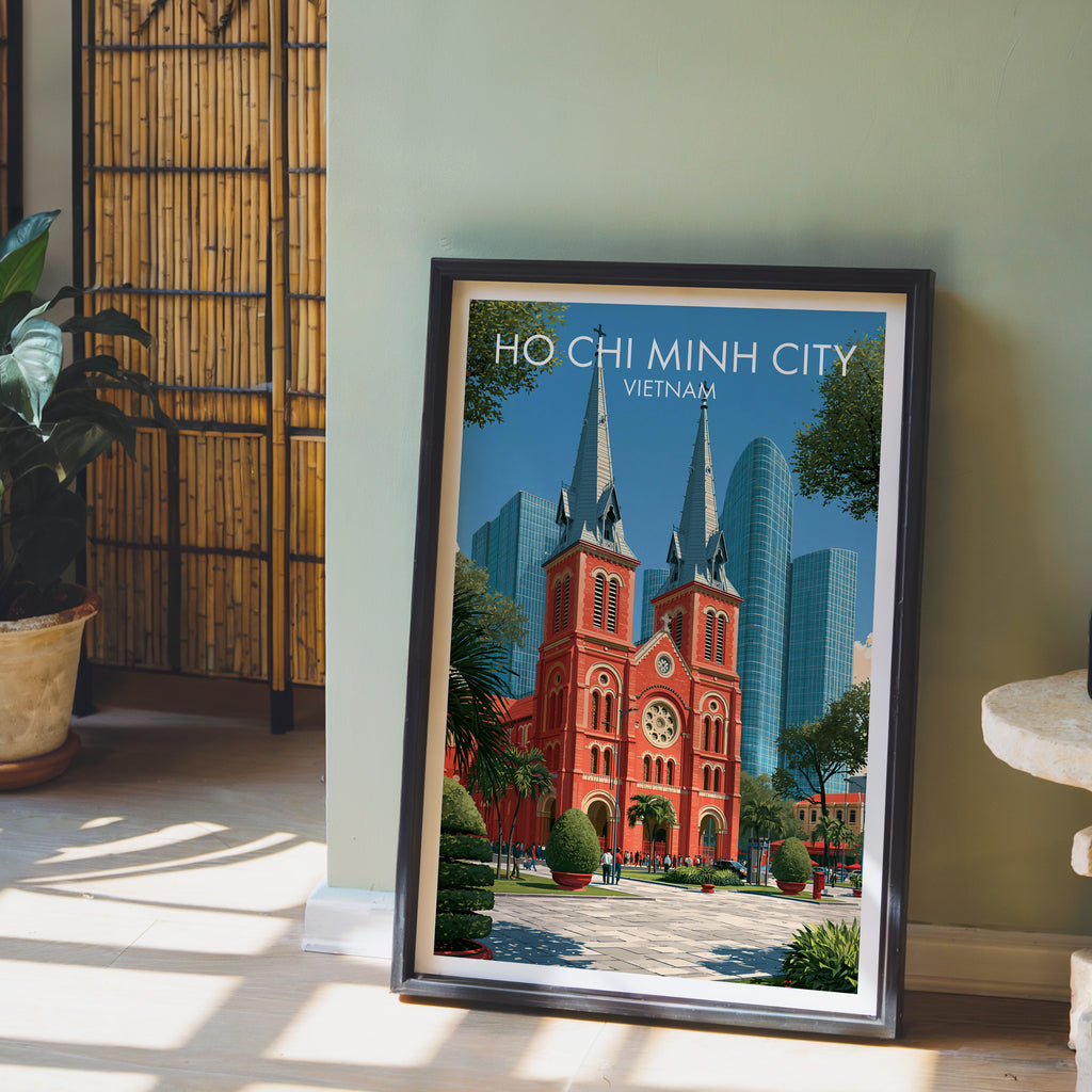 Ho Chi Minh City Vietnam wall art in a black frame leaning against a sage green wall beside a bamboo screen