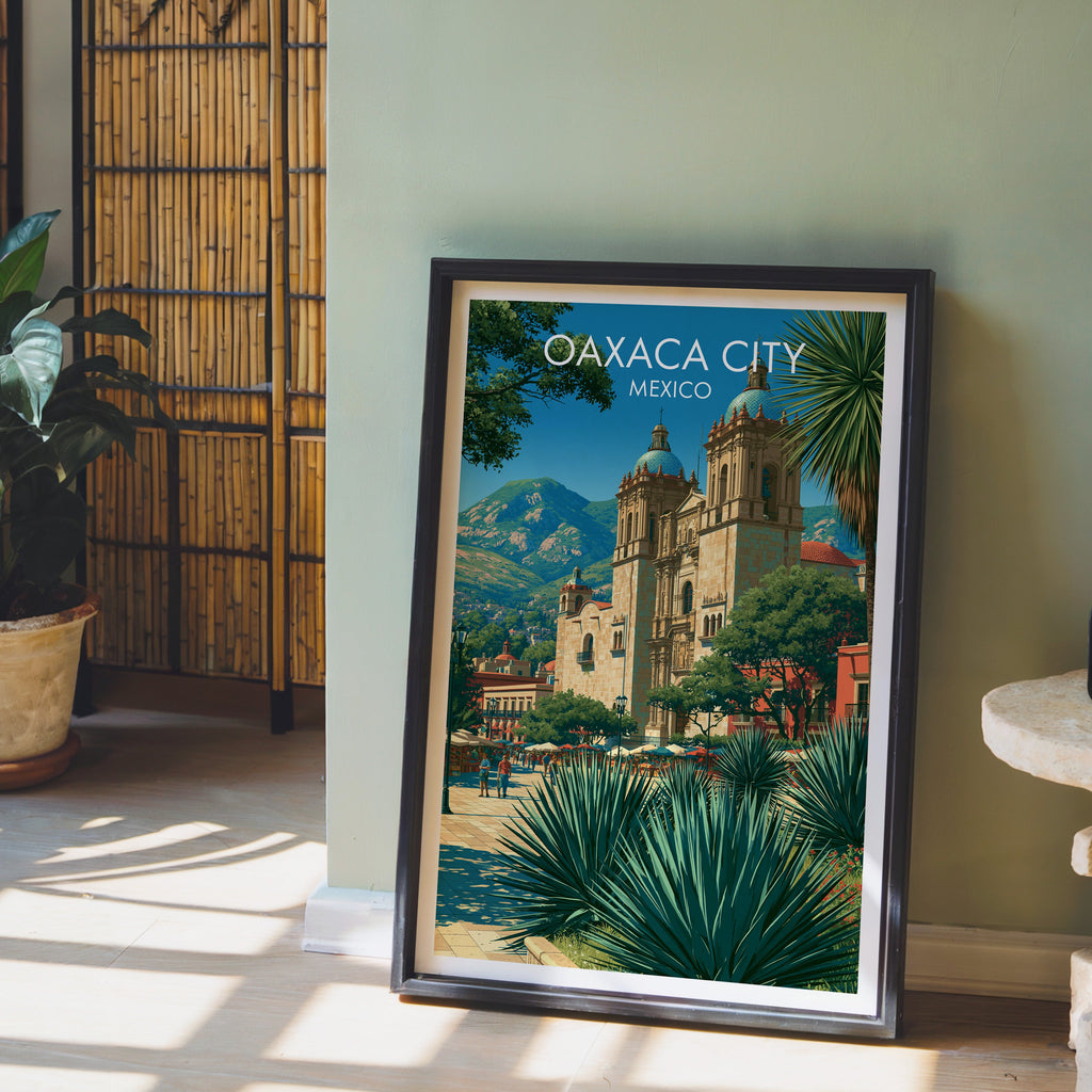 Green mountains behind Oaxaca City, black frame leaning on pale wood floor by a sage wall and bamboo screen
