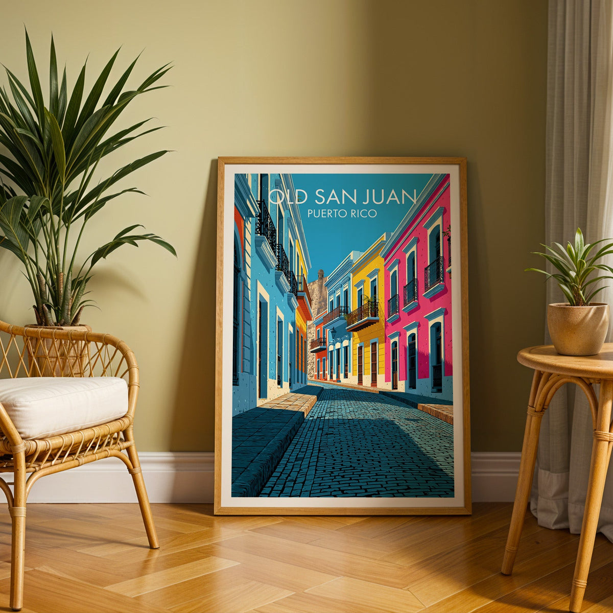 Sky-blue colonial houses in an oak frame leaning on herringbone parquet, rattan chair and cane side table
