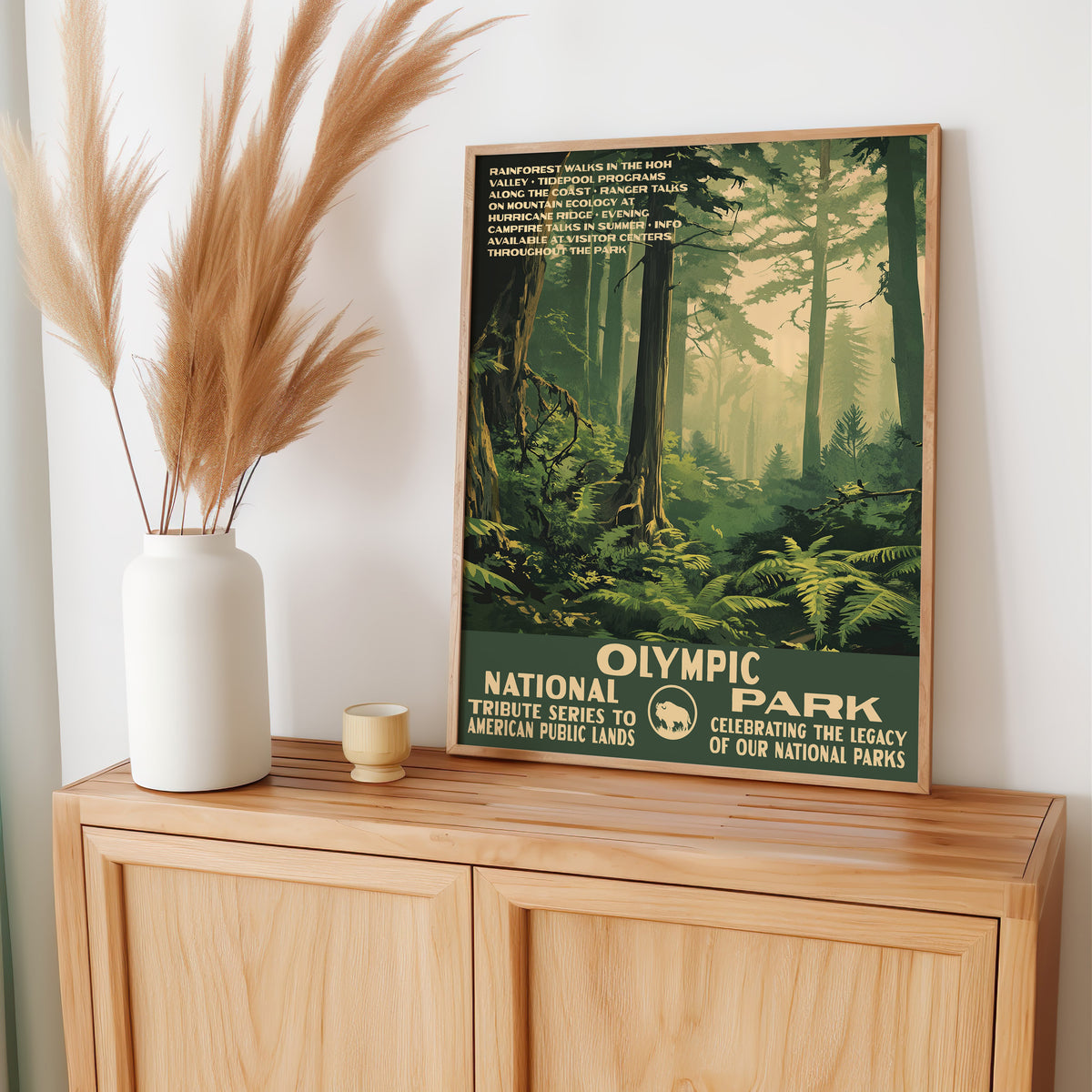 Olympic National Park wall art leaning on an oak sideboard with pampas grass in a vase