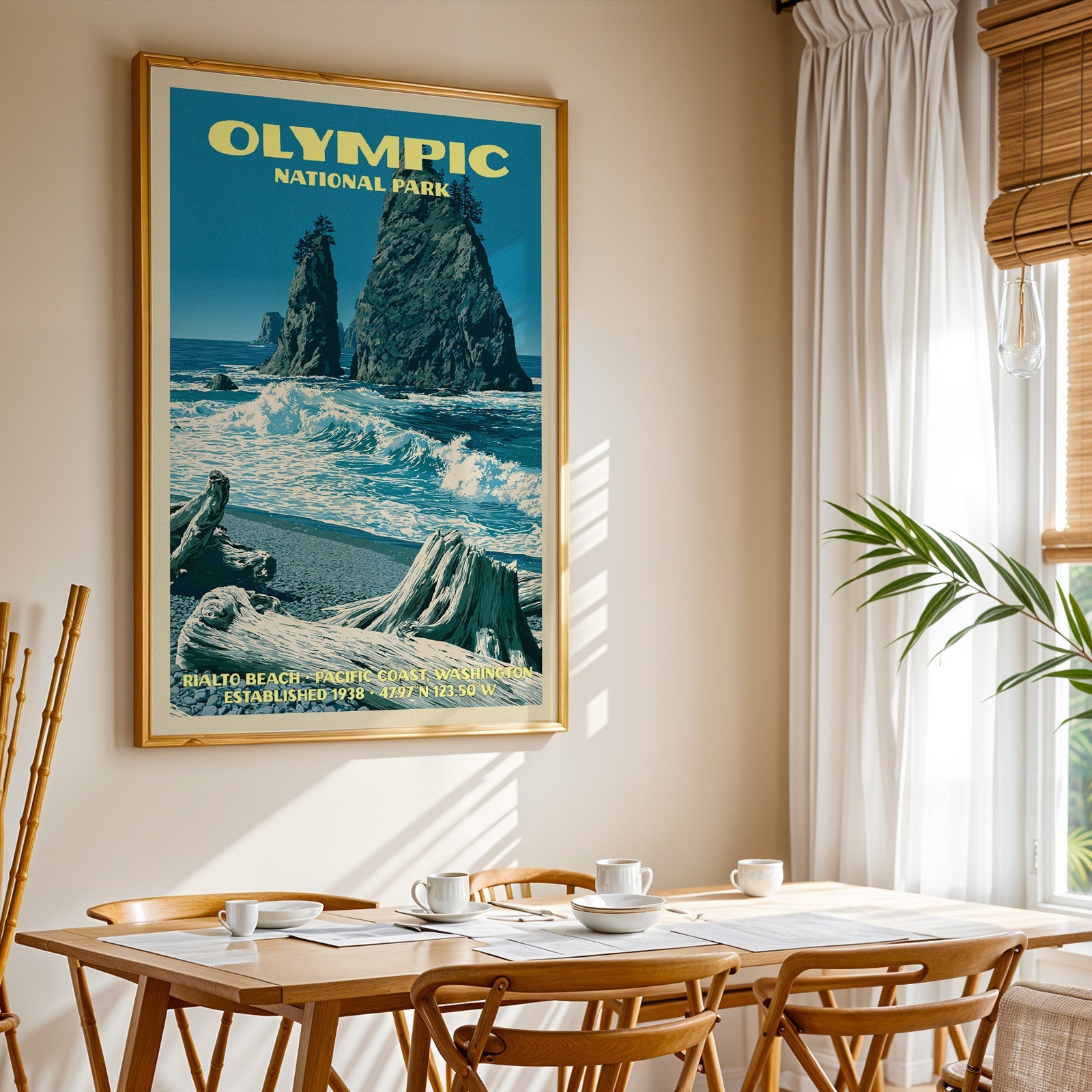 Olympic National Park sea stack print in gold above a light oak dining table by a curtained window