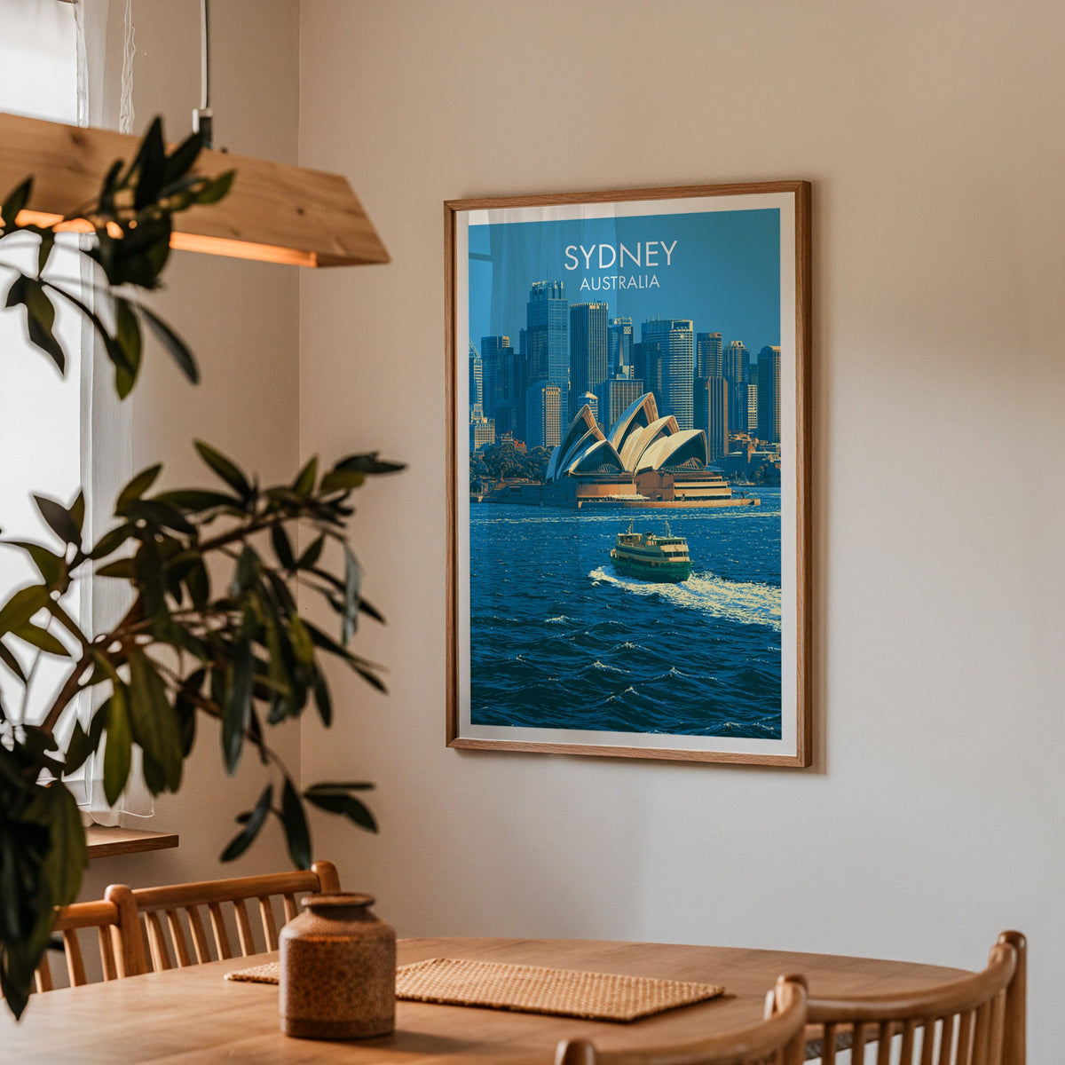 Framed Sydney print in a dining corner with an oak table, spindle chairs and a wood pendant light