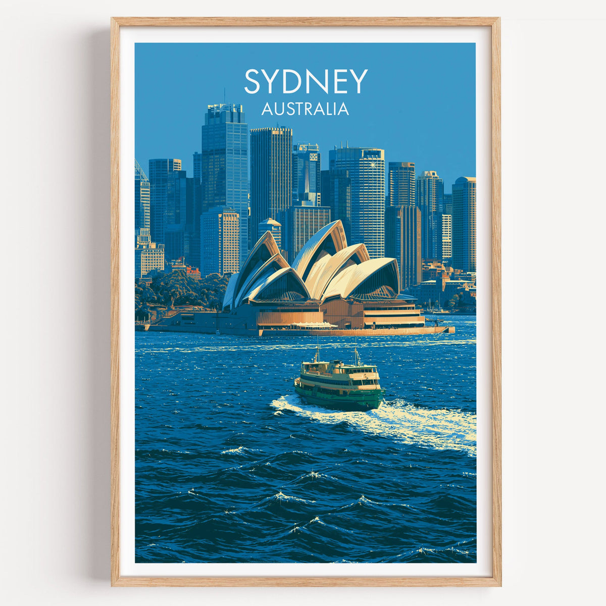 Sydney Opera House travel print in a light oak frame on a plain white wall