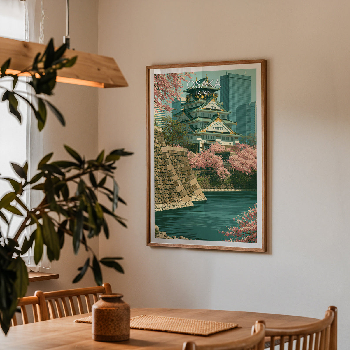Japan castle wall art in an oak frame in a dining corner with an oak table, cane chairs and pendant lamp