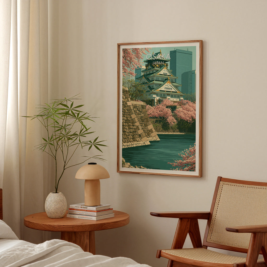 Osaka Castle Japan poster above a bedroom nightstand with a bamboo plant and mushroom lamp