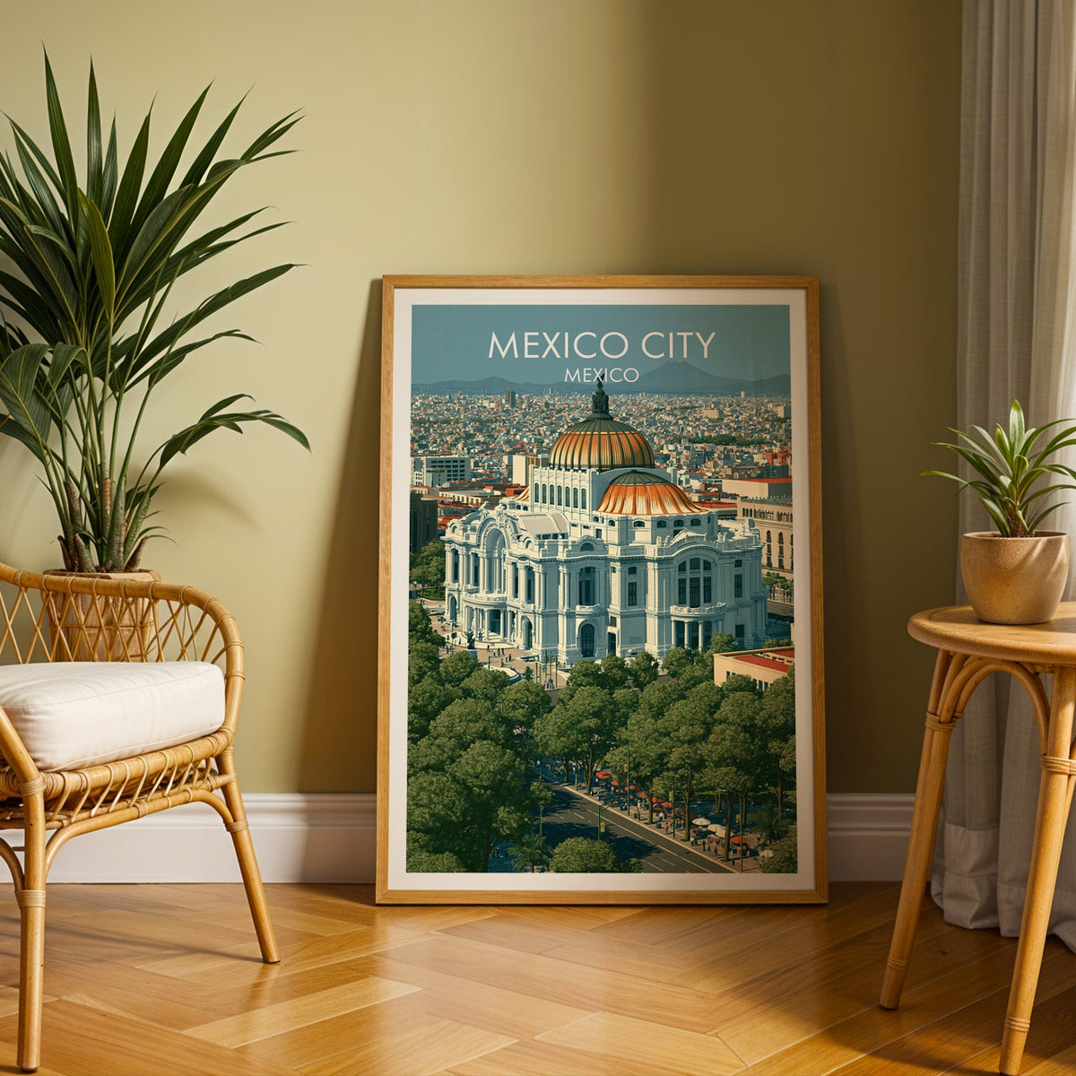 Aerial Mexico City poster in an oak frame on herringbone parquet with a rattan chair and cane side table