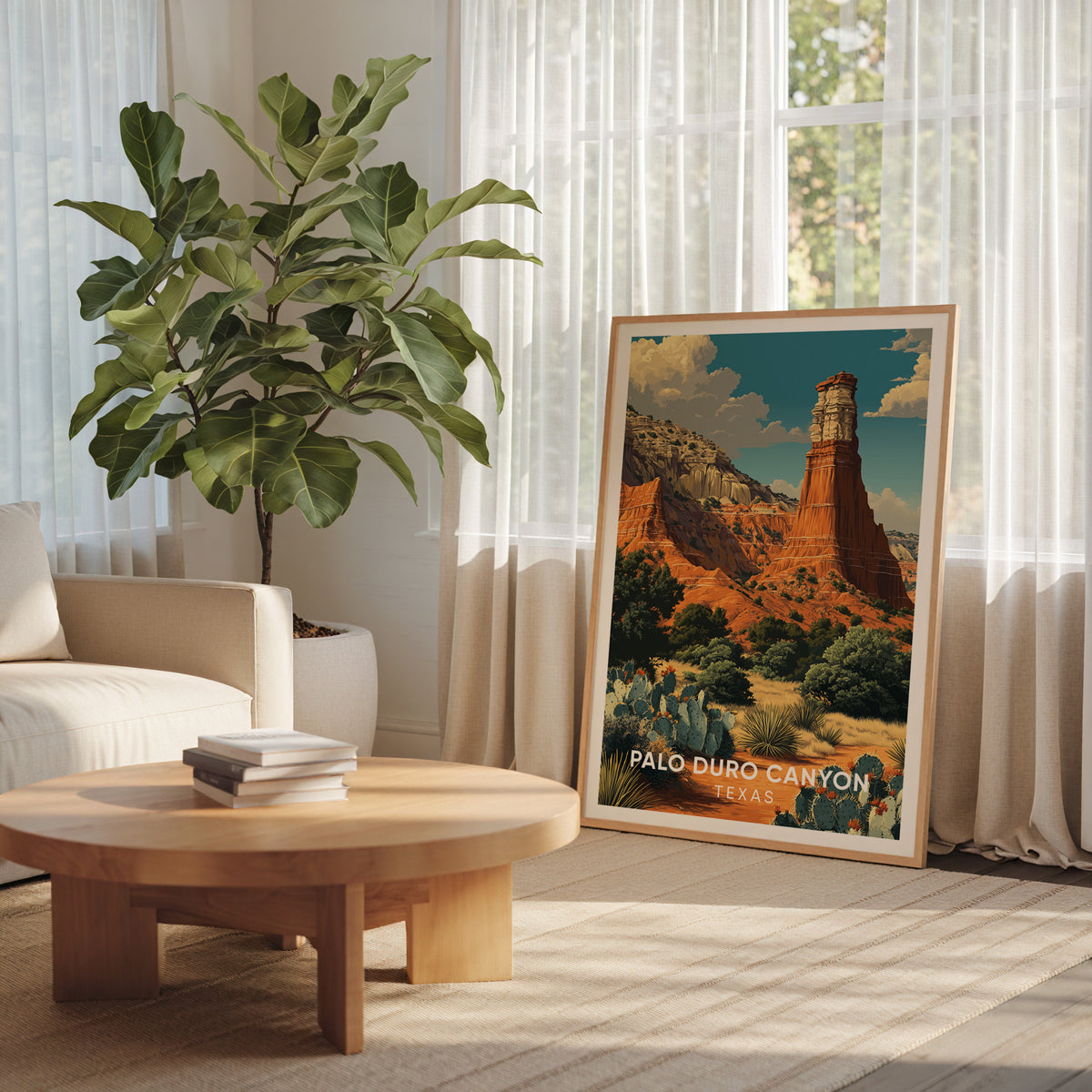 Texas Panhandle canyon poster in an oak frame beside a large cheese plant and a round wood table