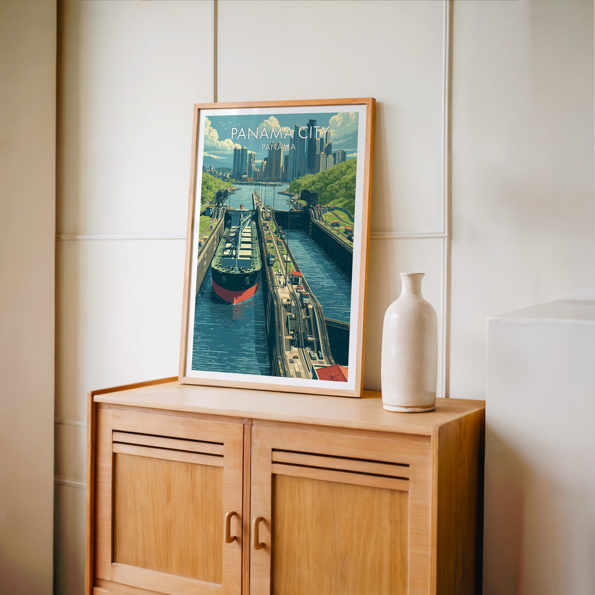 Jungle-green canal banks in an oak frame on a light oak cabinet against a cream panelled wall