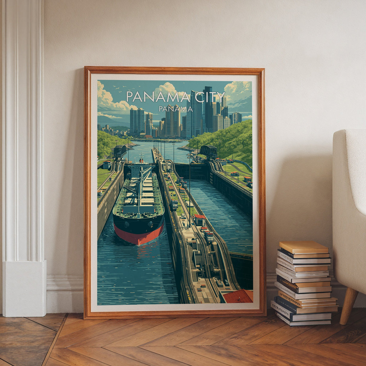 Blue and green travel print in a walnut frame leaning on herringbone floor beside stacked books