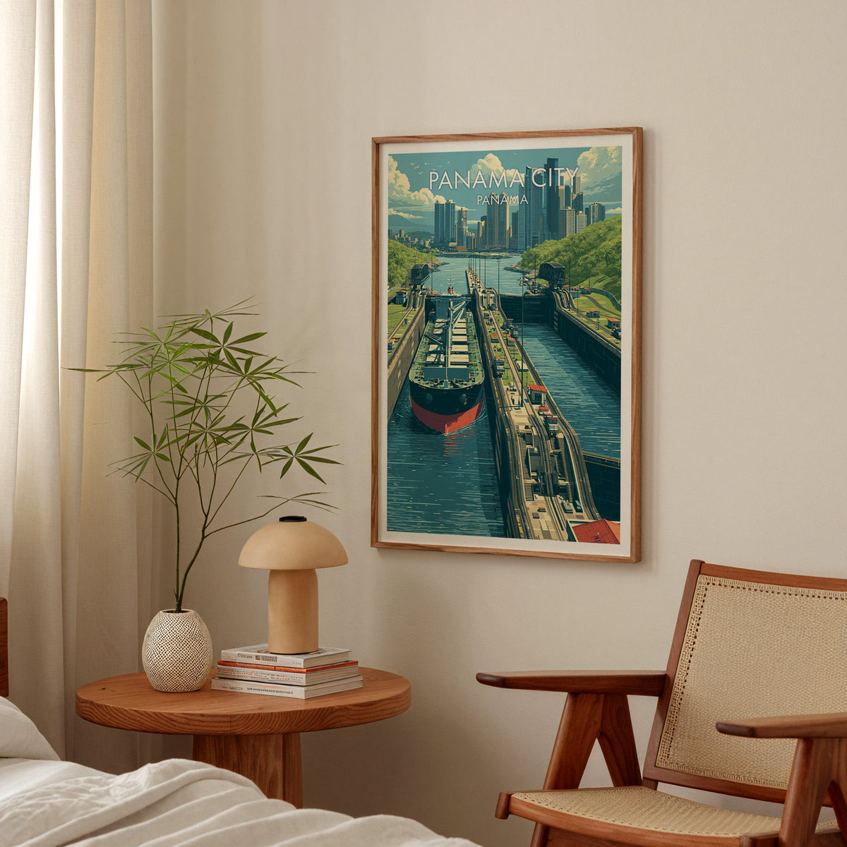 Panama travel art in an oak frame above a bedside table with a mushroom lamp and bamboo stems