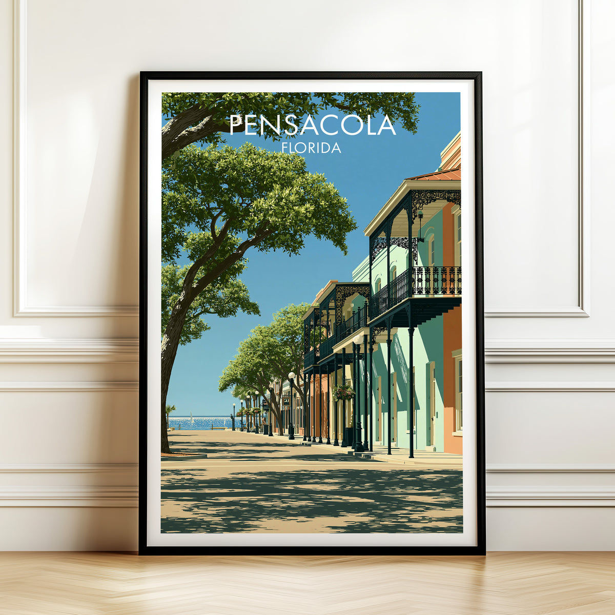 Iron balcony street print in a black frame against white panelled moulding above a herringbone wood floor