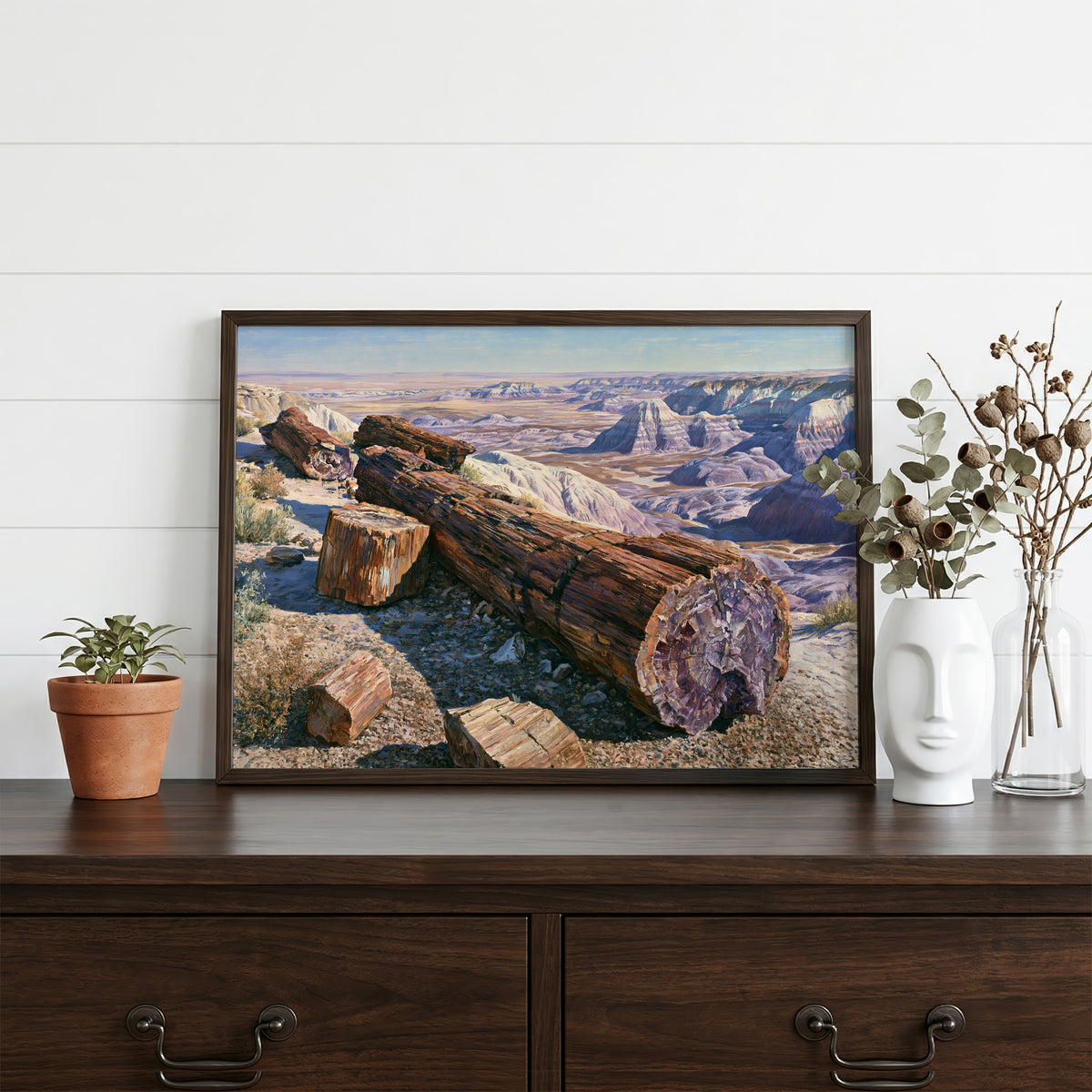 Petrified Forest classical oil painting in a walnut frame resting on a dark wood dresser