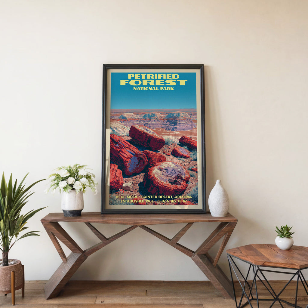 Petrified Forest Blue Mesa wall art in black, leaning on a walnut console with white anemones and a vase