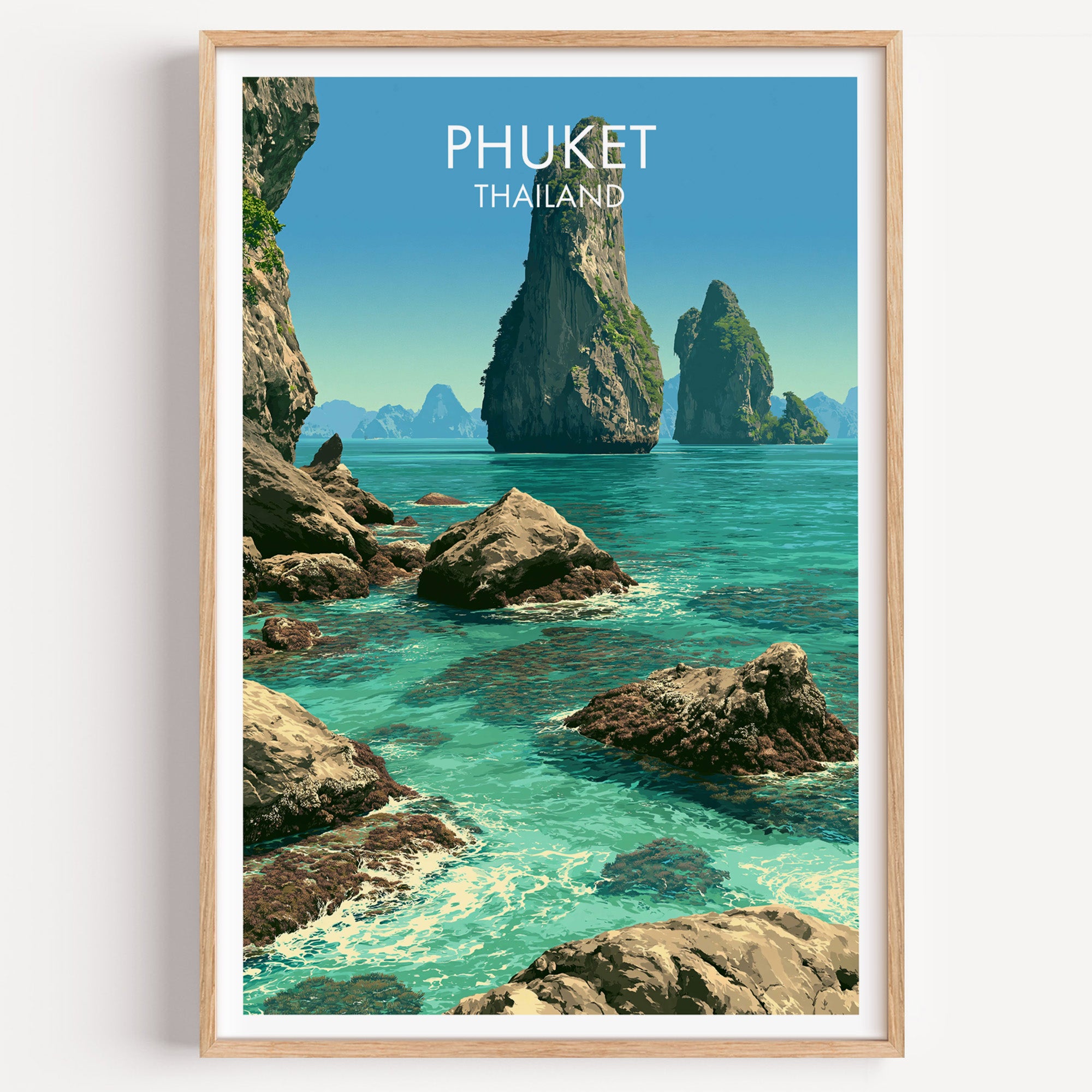 Phang Nga Bay Phuket Thailand travel poster in a natural wood frame, shown against a clean white wall