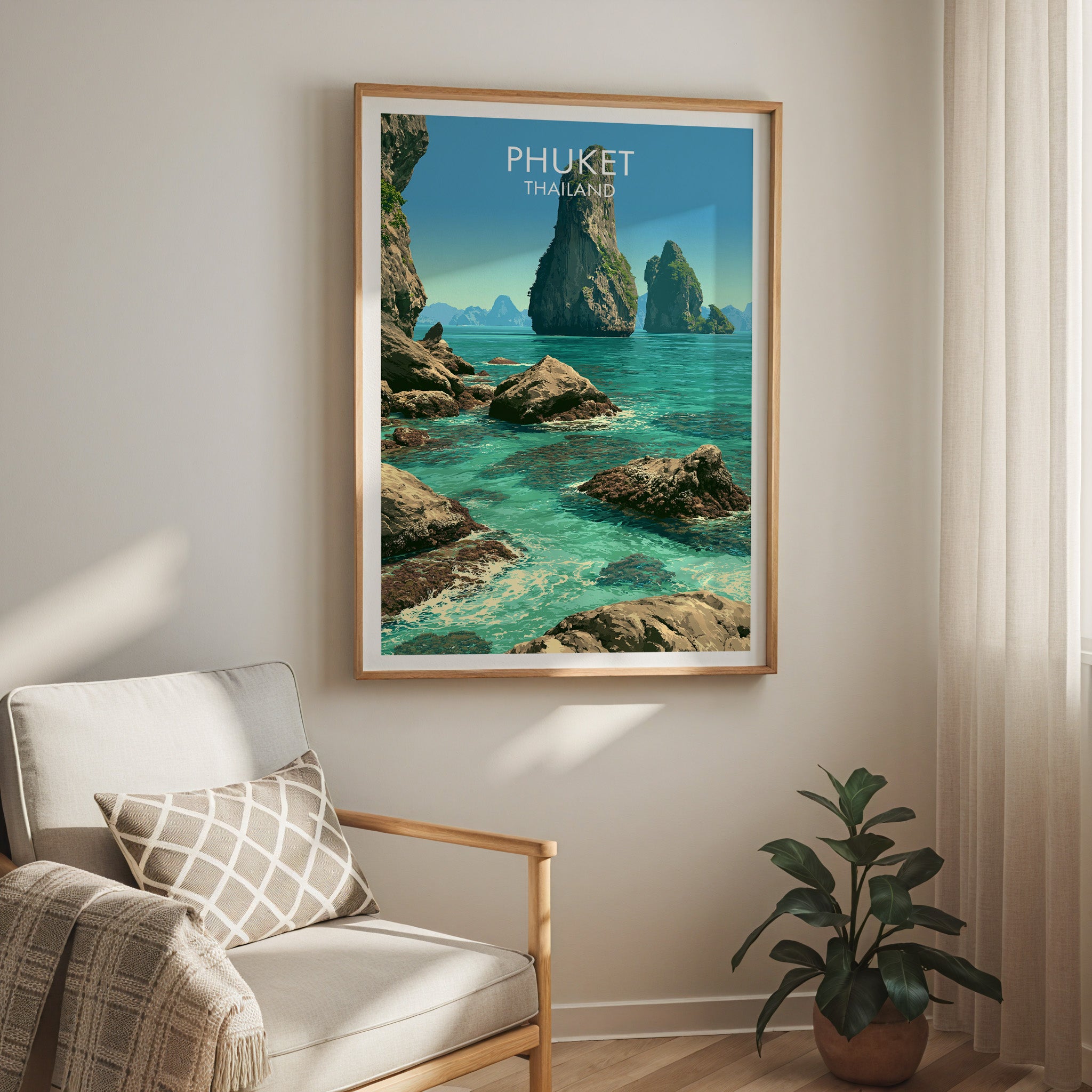 Phang Nga Bay Phuket Thailand travel print in a light oak frame on a living room wall beside a linen armchair