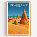 Pinnacles Desert travel poster in a light oak frame on a plain white wall
