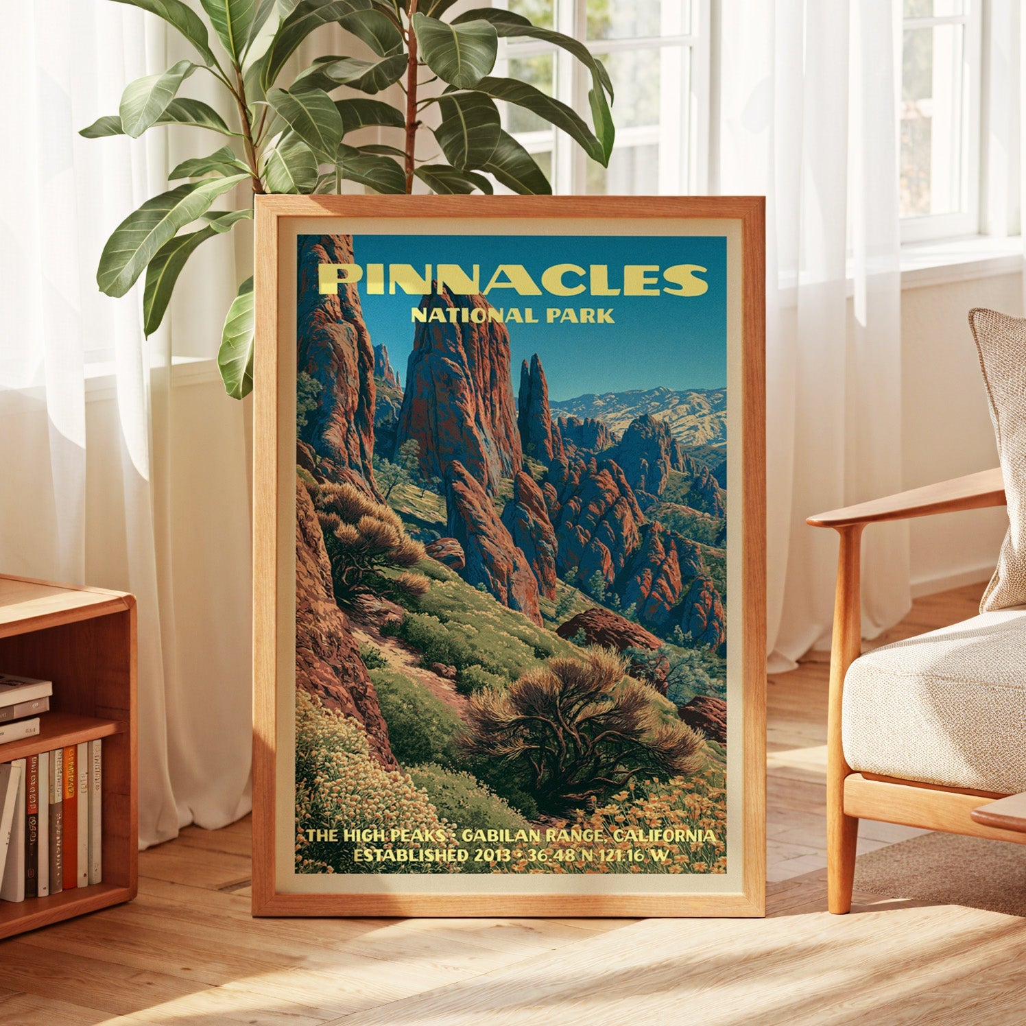 Pinnacles vintage poster in oak, leaning by a sunlit window with sheer curtains and a low bookshelf